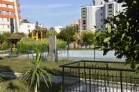 a park with a fence and a tennis court at Serenity Apart in Antalya