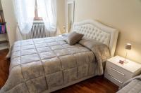 A bed or beds in a room at Domus Fontis Pescaia