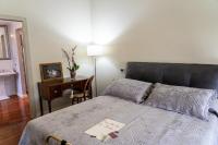 A bed or beds in a room at Domus Fontis Pescaia