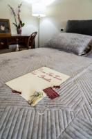 A bed or beds in a room at Domus Fontis Pescaia