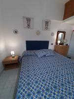 Łóżko lub łóżka w pokoju w obiekcie Casa Marisa