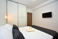 Postel nebo postele na pokoji v ubytování Apartments Radeljić