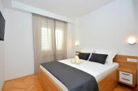Postel nebo postele na pokoji v ubytování Apartments Radeljić