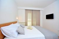 Postel nebo postele na pokoji v ubytování Apartments Radeljić