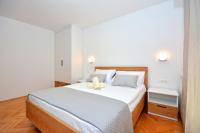 Postel nebo postele na pokoji v ubytování Apartments Radeljić