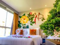 Sino House Phuket Hotel - SHA Plusにあるベッド