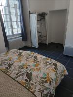 a bedroom with a bed in a room with a window at O&#39;Couvent - Appartement 62 m2 - 2 chambres - A513 in Salins-les-Bains