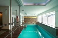a swimming pool in the middle of a house at Hotel Haverkamp in Bremerhaven