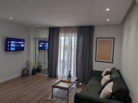 Televízia a/alebo spoločenská miestnosť v ubytovaní Luxury Apartman NR