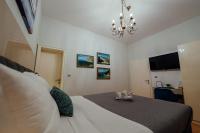Posteľ alebo postele v izbe v ubytovaní Guesthouse Villa Diana