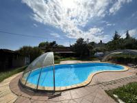 a swimming pool with a clear cover around it at Spacious Holiday Home in Verteneglio in Brtonigla