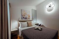 Posteľ alebo postele v izbe v ubytovaní Guesthouse Villa Diana