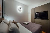 Televízia a/alebo spoločenská miestnosť v ubytovaní Guesthouse Villa Diana