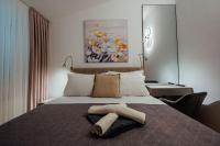 Posteľ alebo postele v izbe v ubytovaní Guesthouse Villa Diana