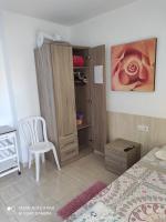 Postel nebo postele na pokoji v ubytování Alojamientos Playa Centro Corralejo 6