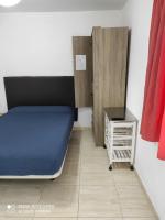 Postel nebo postele na pokoji v ubytování Alojamientos Playa Centro Corralejo 6