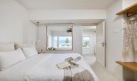 A bed or beds in a room at VLIA Mykonos