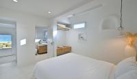 A bed or beds in a room at VLIA Mykonos