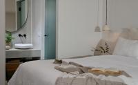A bed or beds in a room at VLIA Mykonos