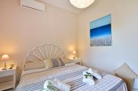 Postel nebo postele na pokoji v ubytování Ariadni Sidari Beach House
