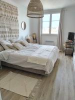 a bedroom with a large bed and a window at Massilia Calling love Appartement de standing 8 personnes Marseille proche métro parking facile in Marseille