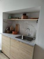 a kitchen with a sink and a counter top at Massilia Calling love Appartement de standing 8 personnes Marseille proche métro parking facile in Marseille