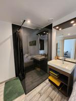 a bathroom with a sink and a mirror at Le clos de lignac in Cieux