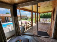 a view from the living room of a house with a sliding glass door at Le clos de lignac in Cieux