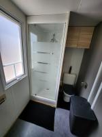 a small bathroom with a shower and a toilet at Le clos de lignac in Cieux