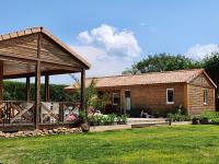 a house with a pavilion in a yard at Le clos de lignac in Cieux