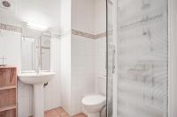 a bathroom with a toilet and a sink and a shower at Obelisque 1B - duplex climatisé in Port-Vendres