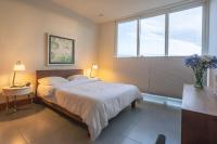 Postel nebo postele na pokoji v ubytování Ultravioleta Boutique Residences