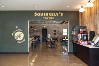 a restaurant with a sunbury tavern sign on the wall at Camp Fimfo Waco in Waco