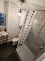 a bathroom with a shower and a toilet and a sink at L&#39;Escale Lafayette - Appartement Rive Gauche in Rouen