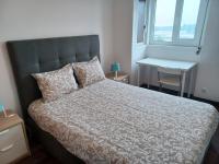Postel nebo postele na pokoji v ubytování Oporto Sea Rooms
