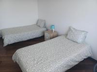 Postel nebo postele na pokoji v ubytování Oporto Sea Rooms