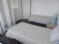 Postel nebo postele na pokoji v ubytování Oporto Sea Rooms