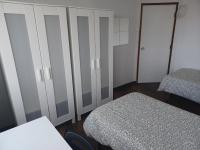Postel nebo postele na pokoji v ubytování Oporto Sea Rooms