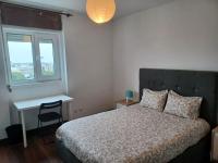 Postel nebo postele na pokoji v ubytování Oporto Sea Rooms