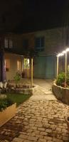 a stone walkway in front of a house at night at Cour st Didier in Nevers