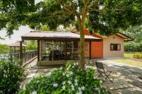 a small building with a tree in front of it at Malala Retreat in Hambantota