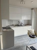 A kitchen or kitchenette at Luxury Central Apartment
