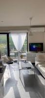 A television and/or entertainment centre at Luxury Central Apartment