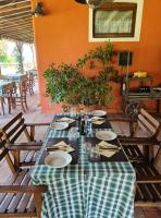 a table with a green and white checkered table cloth at Hotel Il Casolare in Noghera