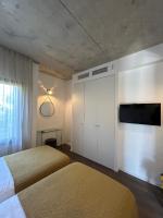 Posteľ alebo postele v izbe v ubytovaní Appartements Les Lofts de Sainte-Lucie-de-Porto-Vecchio