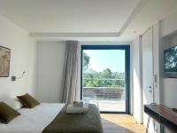 Posteľ alebo postele v izbe v ubytovaní Appartements Les Lofts de Sainte-Lucie-de-Porto-Vecchio