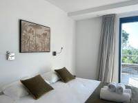 Posteľ alebo postele v izbe v ubytovaní Appartements Les Lofts de Sainte-Lucie-de-Porto-Vecchio