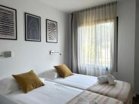 Posteľ alebo postele v izbe v ubytovaní Appartements Les Lofts de Sainte-Lucie-de-Porto-Vecchio