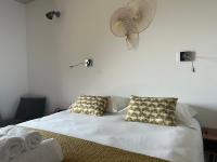 Posteľ alebo postele v izbe v ubytovaní Appartements Les Lofts de Sainte-Lucie-de-Porto-Vecchio