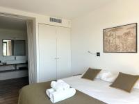 Posteľ alebo postele v izbe v ubytovaní Appartements Les Lofts de Sainte-Lucie-de-Porto-Vecchio